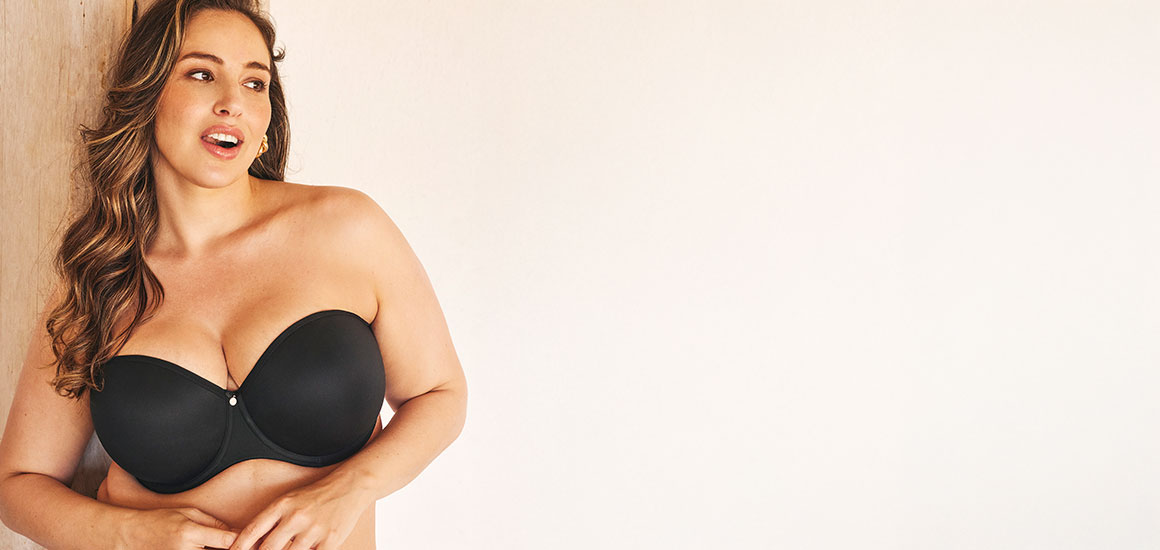 Modal wearing a black strapless bra